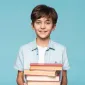 smiley boy holding stack books